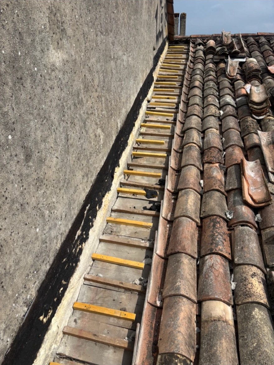 Réfection de la rive contre un mur